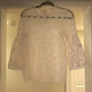 Boho lace bell sleeve crochet top.